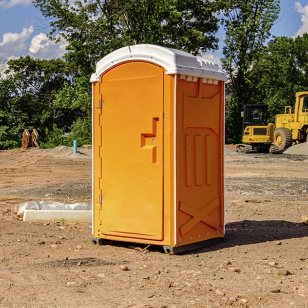 what is the cost difference between standard and deluxe portable restroom rentals in Chouteau